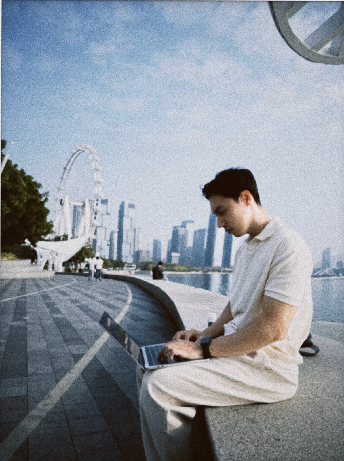 Wynn working beside a city waterfront